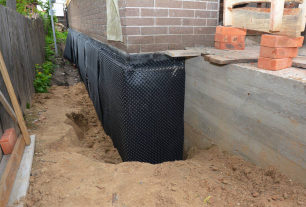 SJ Waterproofing Pros technician performing targeted Exterior Waterproofing assessment in Dover, TN